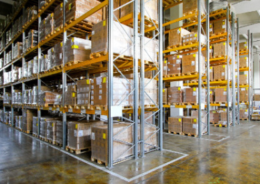 Products sitting on shelving and racks in a warehouse